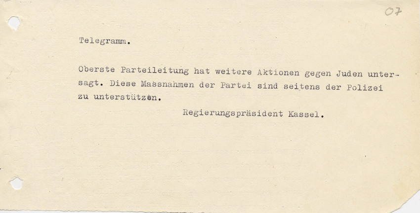 Telegramm des Regierungspräsidents in Kassel an den Landrat in Marburg. Massnahmen der Partei sind durch die Polizei zu unterstützen,  weitere Akionen untersagt, 10. November 1938