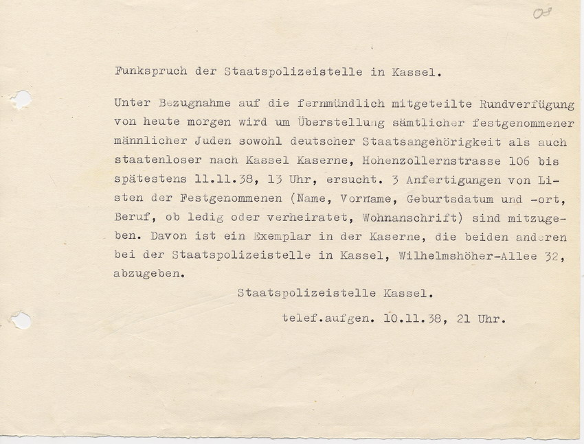 Funkspruch der GeStaPo Kassel an den Landrat in Marburg. Die während der Ausschreitungen festgenommenen Personen sollen nach Kassel überstellt werden, 10. November 1938 gegen 21:00h